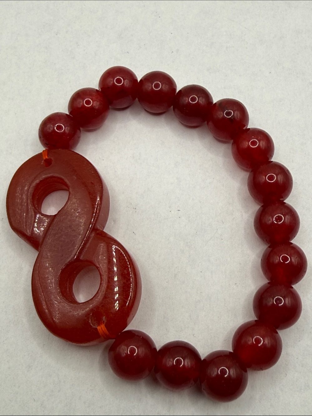 Red gemstone Asian inspired infinity connector gorgeous beaded stretch bracelet